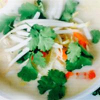 Coconut Noodle Soup · Rice noodles in spicy coconut milk soup with ground chicken, bean sprouts, basil, cracked pe...