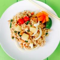 Pineapple Fried Rice · Fried rice with egg, pineapple chunks, onions, green onions, cashew nuts, tomatoes, pea carr...