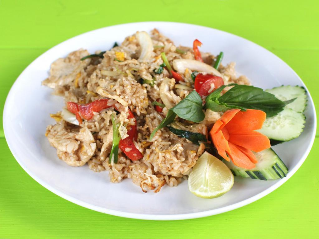 Spicy Fried Rice · Spicy fried rice with choice of protein, egg, garlic, onions, bell peppers, green onions and basil.