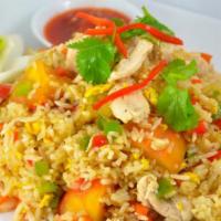 Thai Fried Rice · Fried rice with onions, tomatoes, peas and carrots topped with cilantro and cucumber.