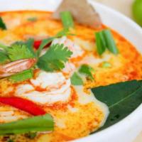 Tom Kha Soup · Spicy coconut milk soup with galangal root, kaffir leaves, lemongrass, tomatoes, onions, mus...