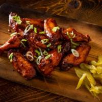 BBQ Wings · Slow-smoked for 2 hours before being quickly fried and tossed in our house-made BBQ sauce. T...