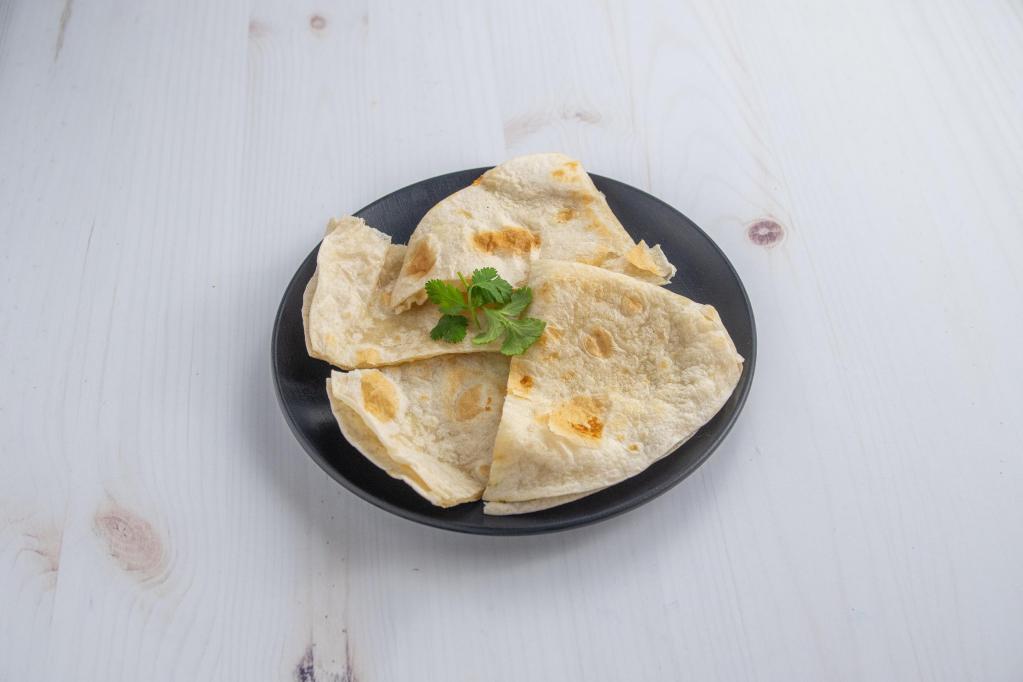 Regular Cheese Quesadilla · Flour tortilla filled with melted cheese. Served with a side of rice, beans, shredded lettuce with pico de gallo, avocado and sour cream.