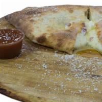 Hawaiian Calzone · Fresh dough, pineapple, ham, country sweet sauce, ricotta cheese, mozzarella and pecorino Ro...