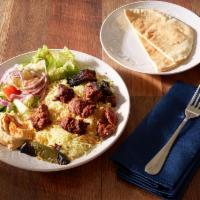Beef Kabab · Served with hummus, salad, rice, parsley, onion and pita bread.