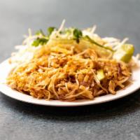 44. Pad Thai · Medium size rice noodles stir fried with eggs, bean sprouts and crushed peanuts.