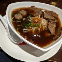 Beef Noodle Soup · Sliced beef, noodles and fresh bean sprouts in beef broth. Topped with seared garlic, cilant...