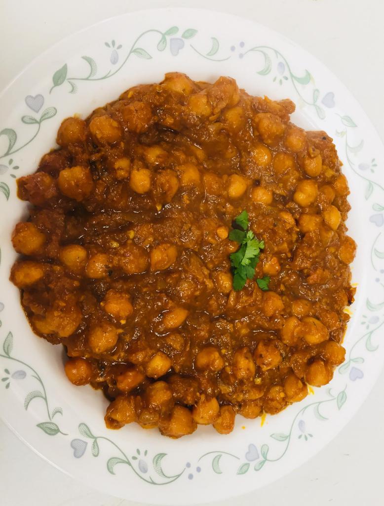 Chana Masala (vegan) · It’s Garbanzo beans curry,  cooked with onion garlic ginger tomato pasta, all Indian spices