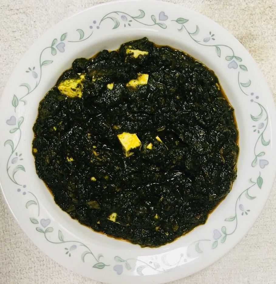 Palak Paneer · It’s mashed spinach, and cheese cube ( paneer) cooked with onion garlic ginger tomato pasta all Indian spices