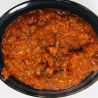 Goat Rogan Josh · 16 oz bowl its Goat meat cooked with onion , Ginger,Garlic , tomato paste ,and ground nuts, ...