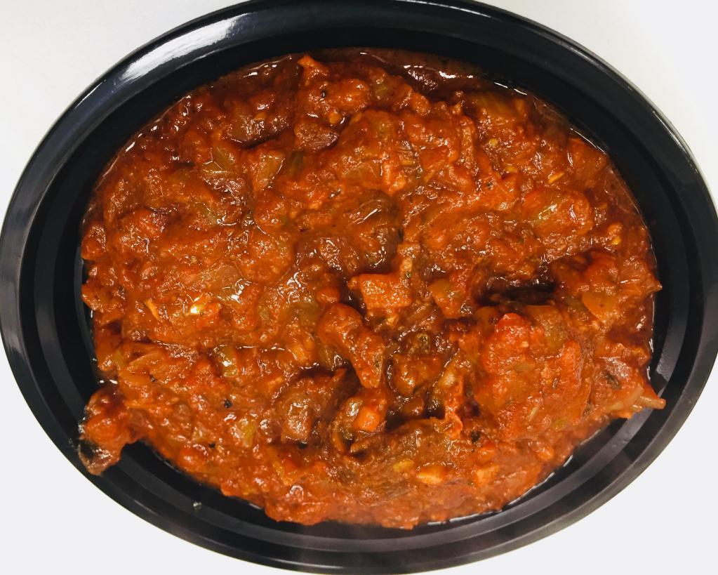 Goat Rogan Josh · 16 oz bowl its Goat meat cooked with onion , Ginger,Garlic , tomato paste ,and ground nuts, Raisins,