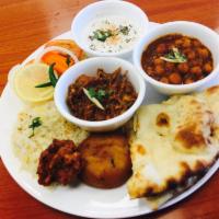Vegetarian Platter ( lunch only )  · veg platter has garbanzo bens curry and shahi paneer ,naan,rice,desert,salad,potato 