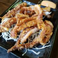 Seasoned Fried Squid Legs · Deep-fried squid legs served with sweet and sour sauce