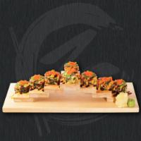 Spicy Tuna Tempura · Deep fried spicy tuna roll topped with roe, jalapeno and eel sauce.