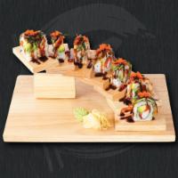 Dragon Roll · Crab stick, avocado, roe topped with eel, avocado and roe.