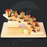 Yummy Roll · Spicy salmon, cucumber, scallion, roe roll topped with salmon, avocado, roe and eel sauce.
