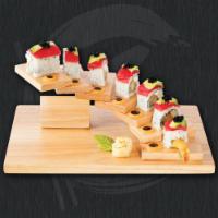 Germantown Roll · Shrimp tempura, cream cheese, avocado roll topped with tuna and black tobiko.