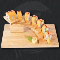 Zombie Roll · Shrimp tempura, cream cheese and avocado topped with seared spicy mayo over crab sticks.
