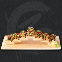 California Transformer Roll · Deep fried crab stick, avocado and cream cheese topped with roe, spicy mayo, eel sauce and s...