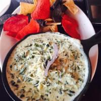 Spinach Dip · Spinach and roasted artichoke with tortilla chips.