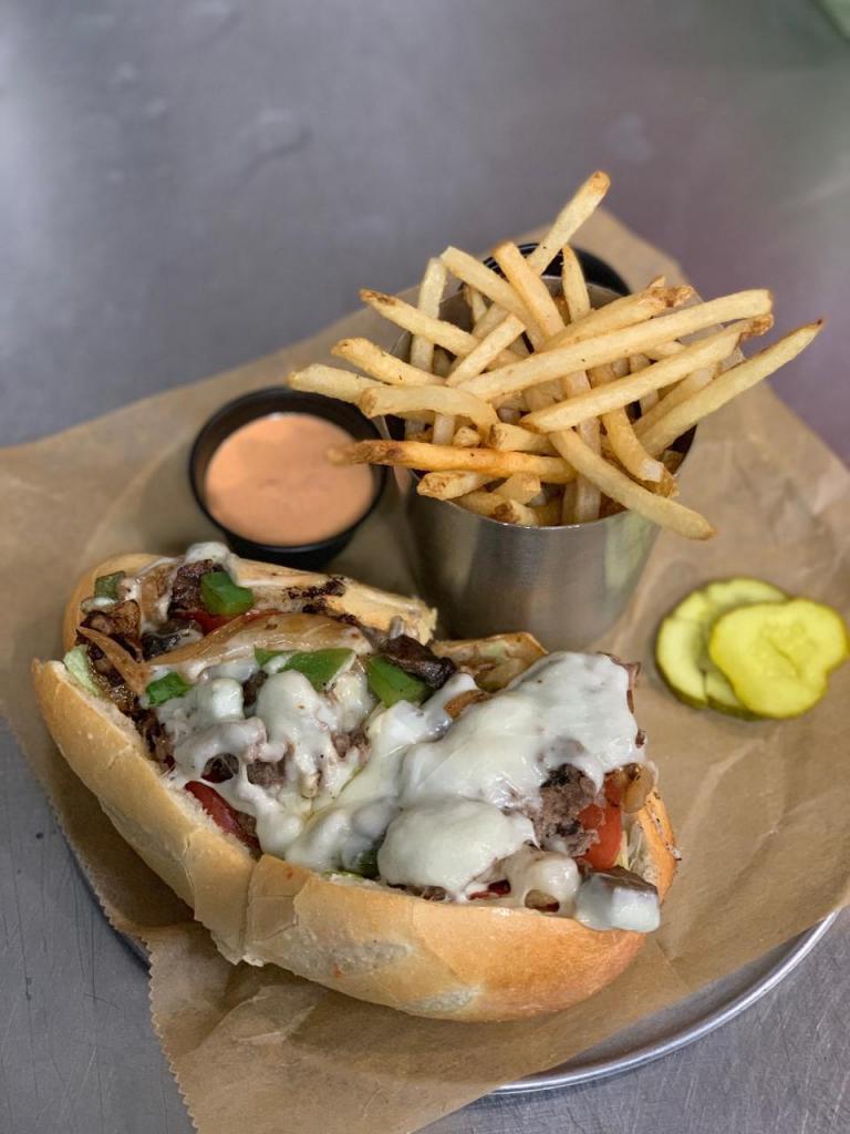 Remingtons Philly · Thinly shaved rib eye steak & provolone cheese topped with your choice of toppings\r\n\r\nMake it “ATW” Lettuce, tomato, mayo, onions, peppers, mushrooms & hot peppers