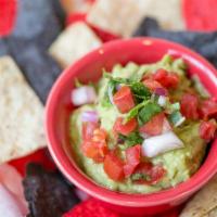 Guac & Chips · Classic appetizer served with tricolored tortilla chips.