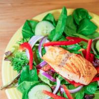 Salmon Salad · Fresh spinach topped with grilled salmon, red onions, fresh red peppers, Kalamata olives, an...