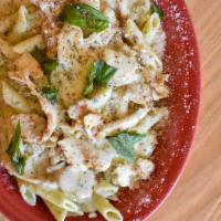 Bkd Chx Pesto · Sliced chicken breast and penne pasta tossed in our creamy pesto alfredo sauce topped with m...