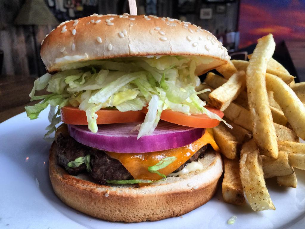 1/2 lb. Tinhorn Cheeseburger · Huge premium Angus beef with lettuce, tomato, onion and mayo. Served with choice of side.