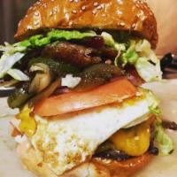 Breakfast Burger · bacon, over easy egg, cheddar, avocado & mayo