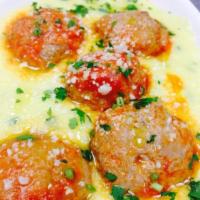 Polpettine · Braised meatballs in tomato sauce.