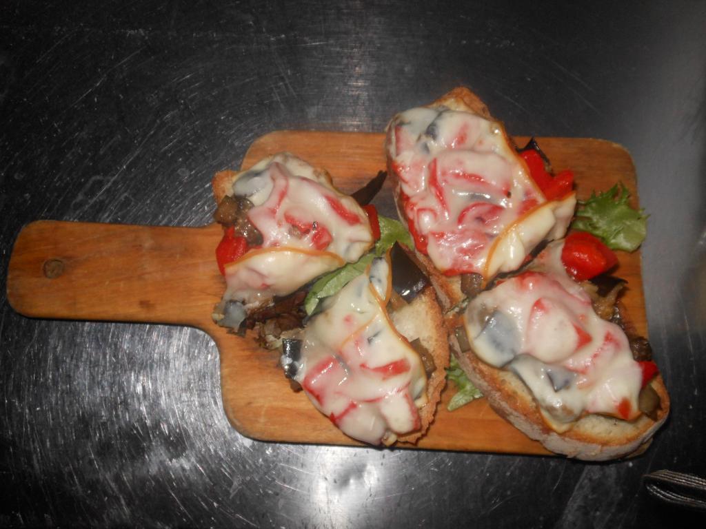 Gustosa Bruschetta · Eggplant, peppers, and smoked mozzarella.