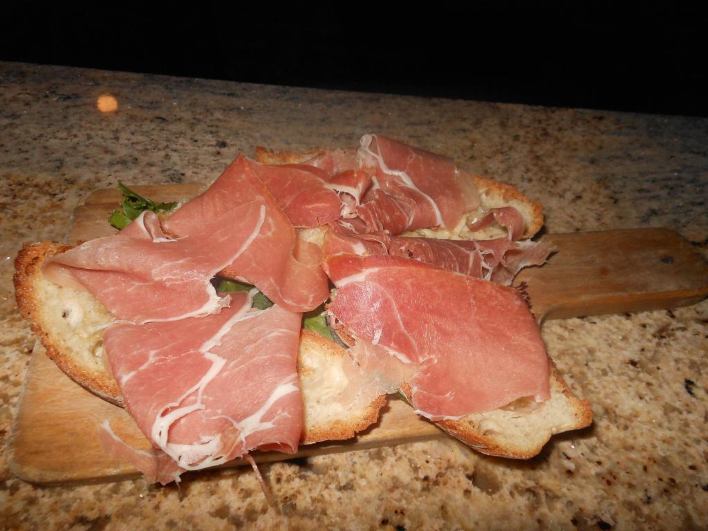 Fettunta Bruschetta · Garlic bread topped with Parma prosciutto.