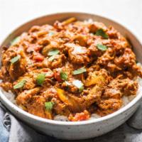 Chicken Tikka Masala Curry · Chicken marinated with spices and yogurt, skewed until it gets tender and served with gravy.