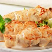 TA4. Chicken Malai Kabab · Mouth watering succulent pieces of chicken marinated in almond fresh cream and fresh herbs c...