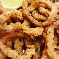 Cajun Fried Calamari · Chipottle buttermilk marinated calamari rings fried to crisp golden brown, served with roast...