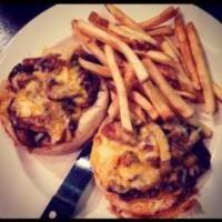 Roasted Beef BBQ Sandwich · Slow roasted beef thinly shaved tossed with Spicy BBQ sauce, onions and mushrooms topped wit...