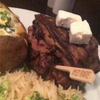 Filet Mignon Au Poivre · 8 ounce of tender steak rolled in peppercorns topped with grilled portabello mushrooms, feta...