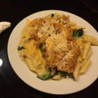 Chicken Parmesan Primavera · Spinach, onions and mushroom tossed with penne pasta in creamy cheese sauce topped with brea...