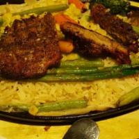 Steak Sizzle · GRILLED STEAK THINLY SLICED PLACED OVER A MEDLEY OF STIR FRIED VEGETABLES AND RICE DRIZZLED ...