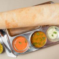 Masala Dosa · Rice and lentil crepes served with potato curry along with lentil soup, coconut and tomato c...