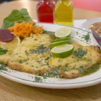 13. Pechuga al Limon · Grilled chicken breast in lemon sauce with rice, crenchas fríes and salad.