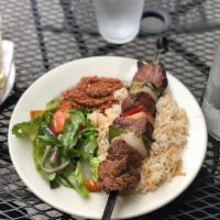 Lamb Kebab Plate · Includes rice pilaf, choice of side dip, choice of salad, and pita bread.