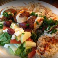Falafel Plate · Includes rice pilaf, choice of side dip, choice of salad, and pita bread. Vegan.