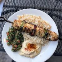 Chicken Kebab Plate · Includes rice pilaf, choice of side dip, choice of salad, and pita bread.