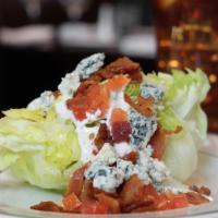 The Wedge · Iceberg lettuce, bleu cheese crumbles, bacon, tomatoes, bleu cheese dressing.