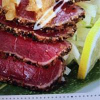 Pepper Tuna Tataki · Quick seared pepper tuna sliced thin over a bed of cucumber with wasabi mayo and crunchier. ...