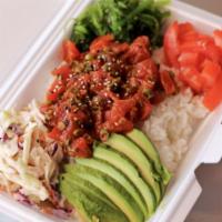 Spicy Poke Bowl · Tuna or salmon, spicy mayo, masago, scallions and sesame seeds.