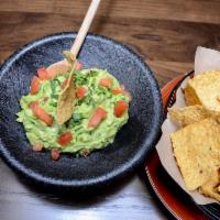 Our Famous Guacamole · Prepared with crispy tortilla chips.