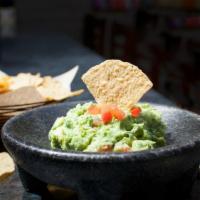Gluten Free Our Famous Guacamole · Prepared with corn chips. Gluten free.
